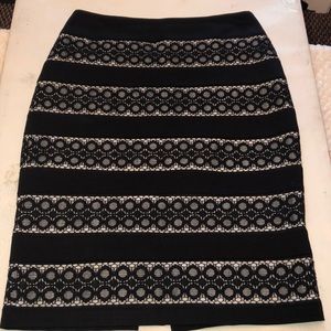 WH- black and white skirt.